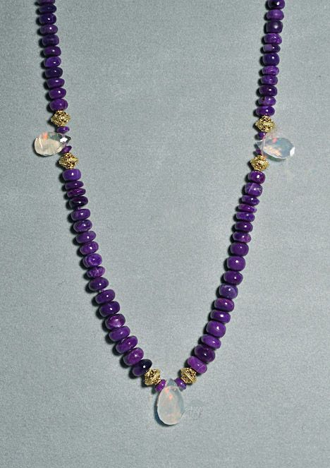 The necklace is 18 inches long with Sugilite beads that range in size 